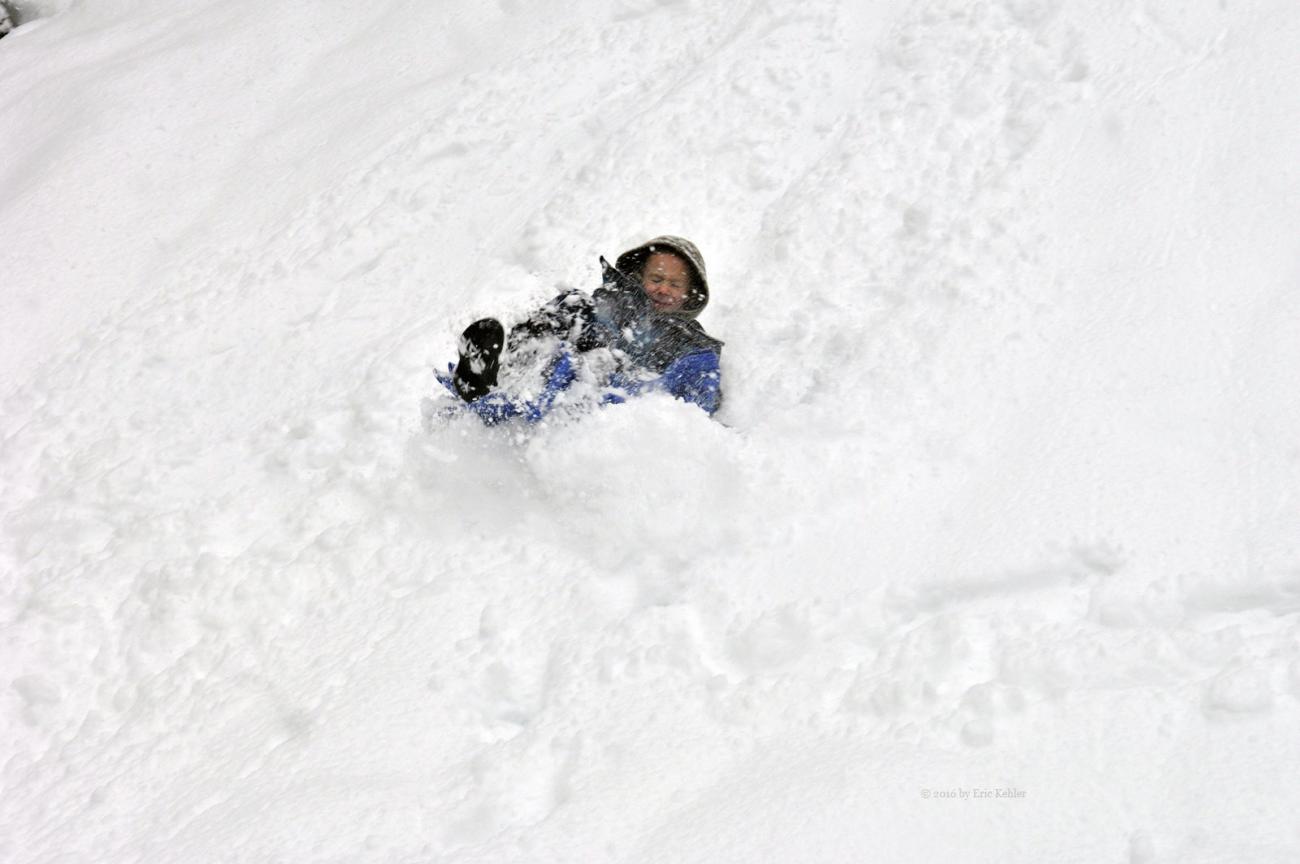 Liam enjoying a slide down the fresh snow