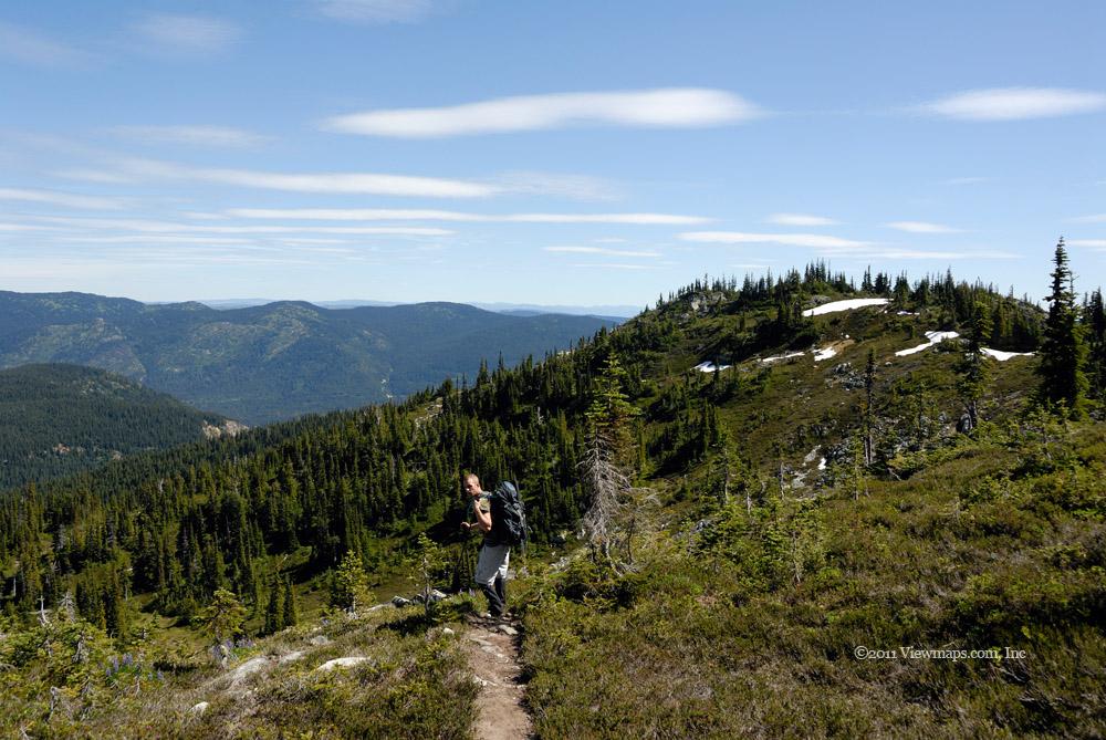 Geoff on the trail heading back, the lower of the two Zoa peaks in the background