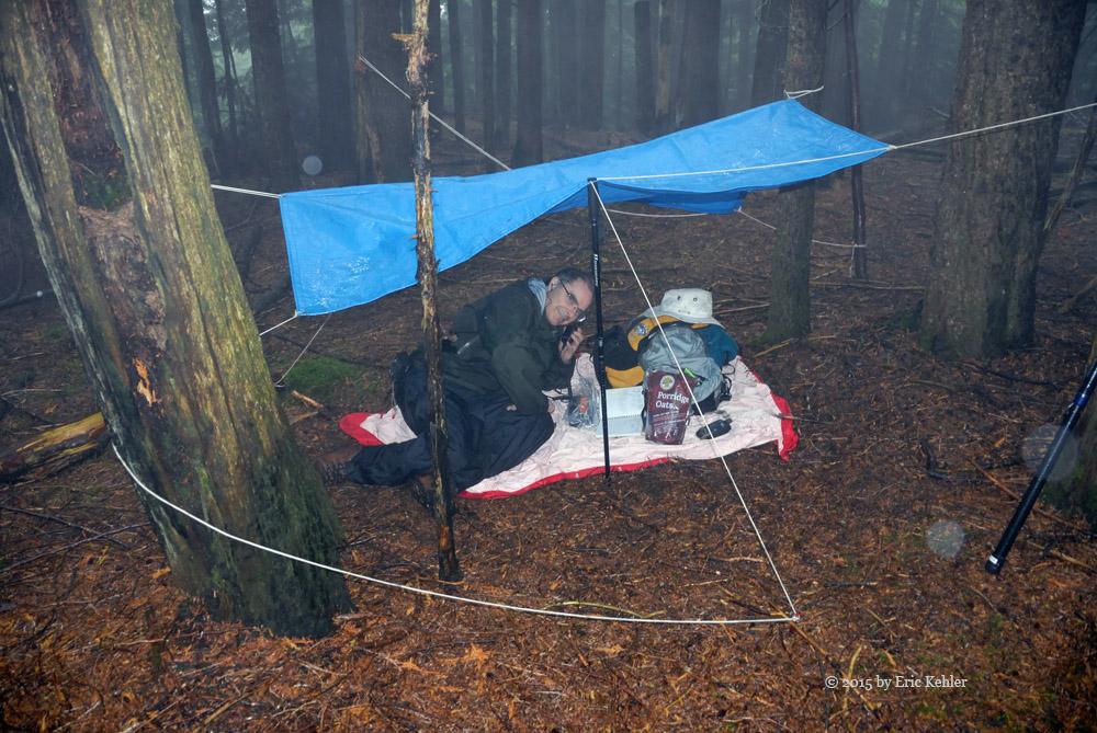 Brett under his tarp making a radio contact