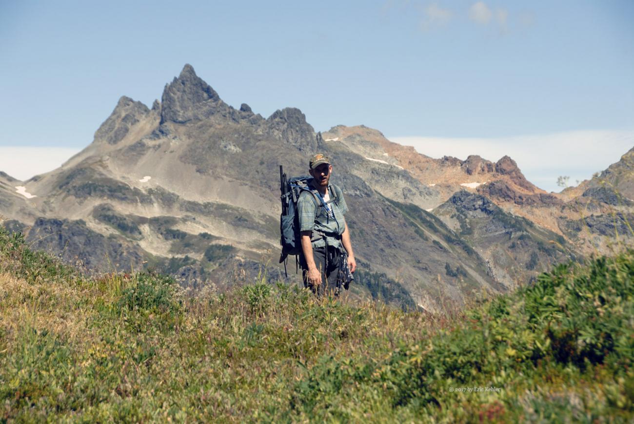 Geoff on the trail to the summit with Baby Munday Peak in the distance