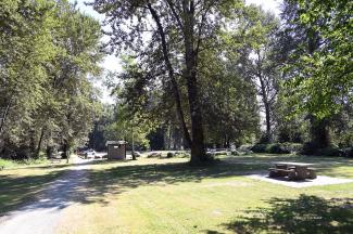 Looking back at the parking area from the far western end of the grassy area