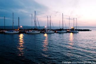 The pier is home to a number of sailboats.