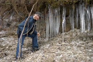 Geoff exploring an ice encrusted over-hang