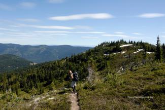 Geoff on the trail heading back, the lower of the two Zoa peaks in the background