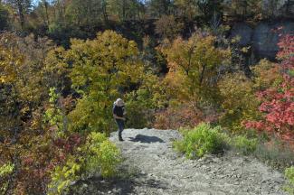 Mike standing on the cliff looking at Buttermilk Falls