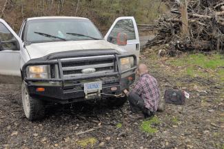 Geoff checking the loose bumper and tightening some bolts before it fell off