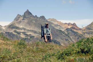 Geoff on the trail to the summit with Baby Munday Peak in the distance