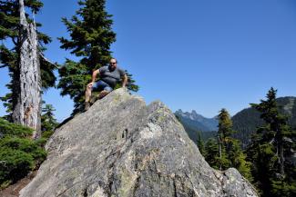 Nick on the highest point of the summit