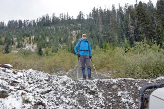 John on the road we were about to hike with the ridge line behind