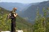 Geoff checking his GPS, Lake Kawkawa peaking out in the distance