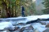 Geoff crossing the creek on what remains of the old brisge
